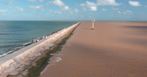 Establishing aerial shot of the Surfside beach trail in Lake Jackson, Texas off the Gulf of Mexico