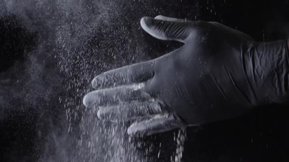 Close Up Of A Chef Wiping Flour From Hands