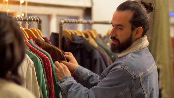 Couple Choosing Clothes at Vintage Clothing Store 37