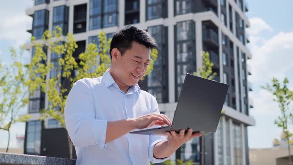 Chinese Crypto Investor Working Outdoors