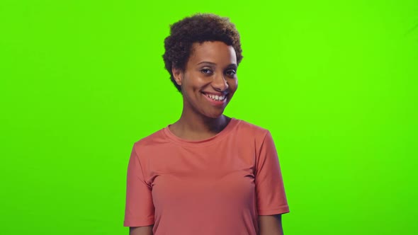 Emotional Dark Skinned Female Smiles, Makes Confirmation Gesture on Green Screen