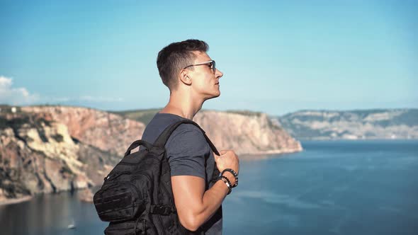 Medium Shot Backpacker European Men in Sunglasses Enjoying Amazing View of Sea Harbour