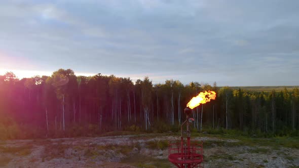 A Drone Flies Around a Burning Torch at an Oil Field in Canada