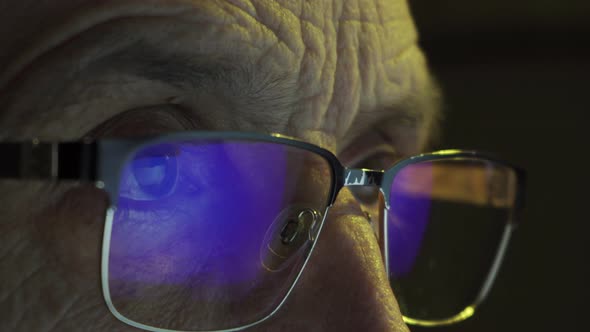 Focused Eyes of a Businessman Wearing Computer Glasses