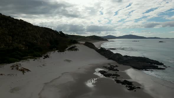 Sea Waves On Ocean Beach At Whangarei Heads On A Cloudy Day In New Zealand. - aerial