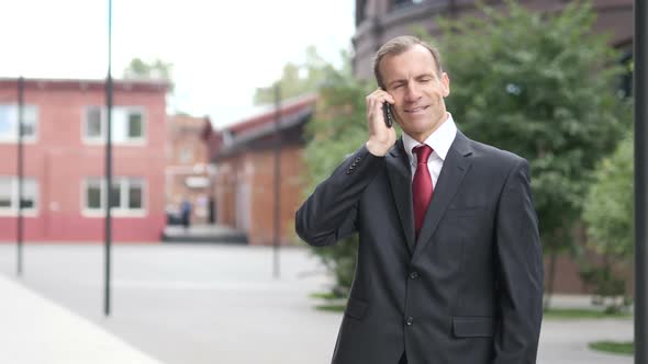 Businessman Talking on Phone