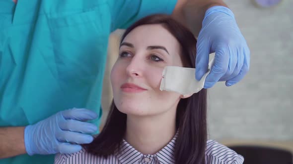 Closeup of Woman's Face Disappointment After Plastic Surgery