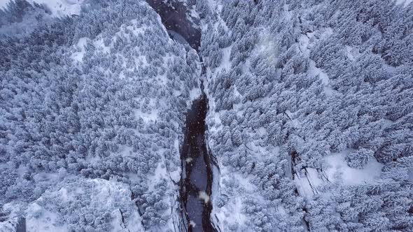 aerial dolly shot of the grindelawld gletscherschluct gorge in winter