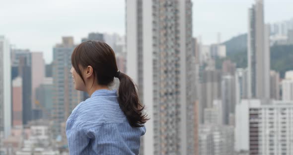 Woman look the city view in Hong Kong