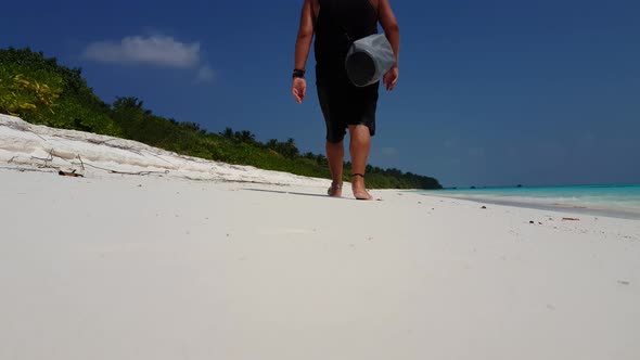 Wide fly over abstract view of a sunshine white sandy paradise beach and aqua turquoise water backgr