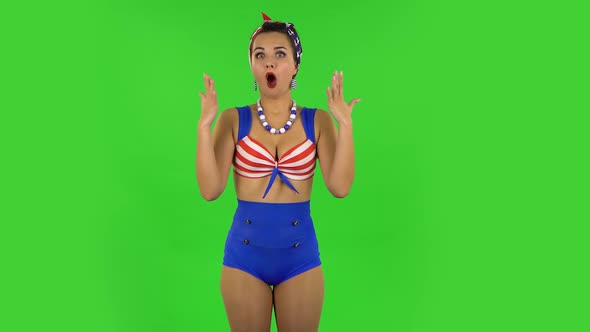 Surprised Girl in a Swimsuit Is Saying Oh My God and Being Shocked. Green Screen