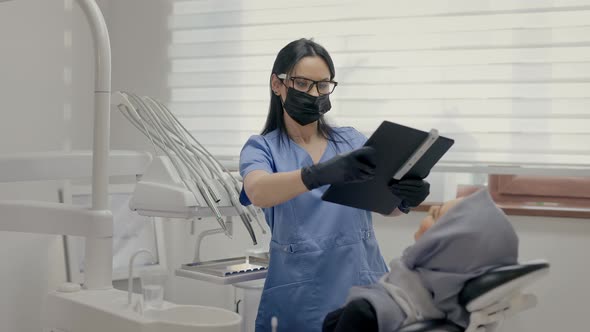 Dentist Working In Office