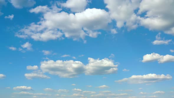 Beautiful White Clouds Floating At The Blue Sky On A Sunny Day