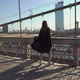 Woman in Black Long Flowing Dress Posing at Brooklyn Bridge in New York - VideoHive Item for Sale