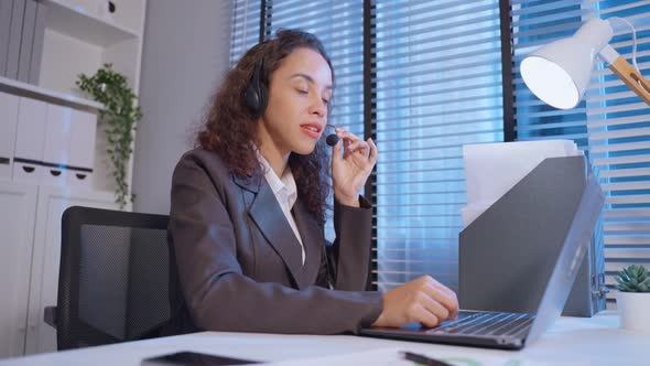 Latino beautiful business woman call center smile while work in office.