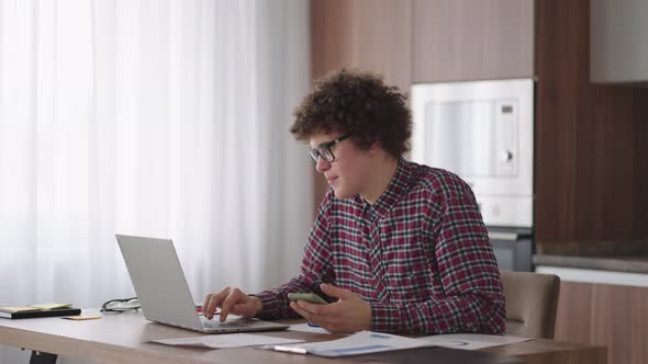 Young Man with Smartphone in His Hands