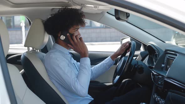 Closeup African American Guy Picking Up Phone at Car