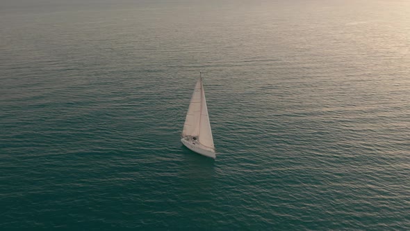 Aerial View. Yacht Sailing on Opened Sea. Sailing Boat. Yachting Video Footage. Yacht From Above