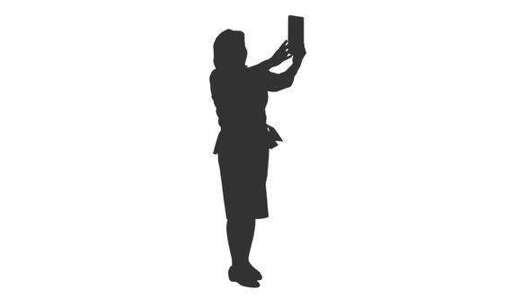 Silhouette of Elegant Woman Taking Selfie with Ipad