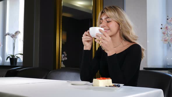 Portrait of Relaxed Young Woman Drinking Coffee
