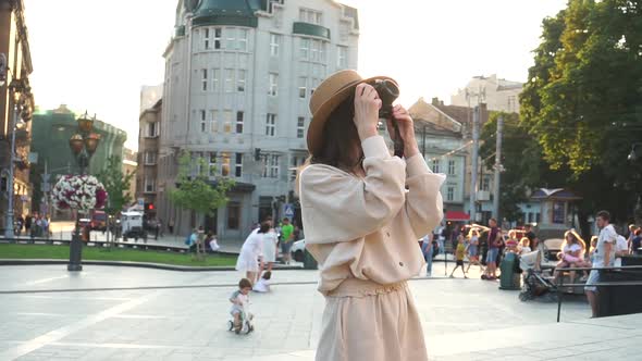 Millennial Hipster Girl Tourist in Casual Outfit Photographing Buildings Architecture Slow Motion