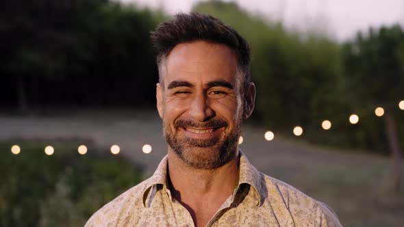 Portrait of Happy Mature Man Looking at Camera Outdoor