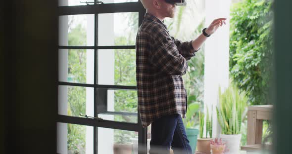 Albino african american man with dreadlocks using vr headset