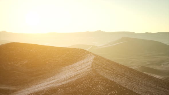 Aerial View on Big Sand Dunes in Sahara Desert at Sunrise alt