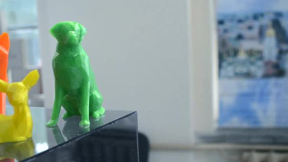 Many Bright Multicolored Objects Printed on 3d Printer Lie on Flat Surface