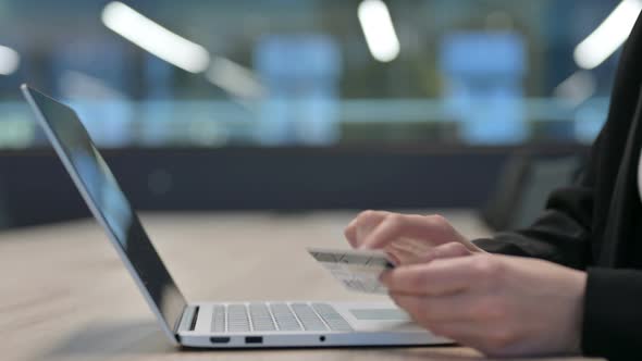 Close Up of Female Hands Making Online Payment on Laptop