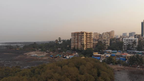 Rising shot over the Mumbai coast at dawn at low tide