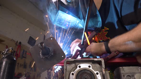 Welding In Protective Mask