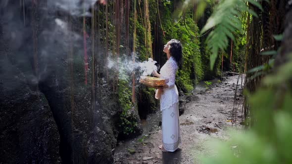 Young Woman in Long White Dress Burning Incenses Sacred Mysterious Ceremony in the Exotic Tropics