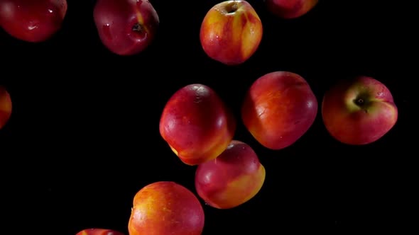 Juicy Peaches Fly Up and Bounce in Water Splashes