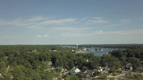 Rising aerial shot overlooking Pentwater lake in downtown Pentwater Michigan