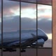 Airplane Takes Off in Reflections of Airport Windows - VideoHive Item for Sale