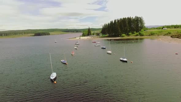 Boats lined up at moorings at brenig lake north wales