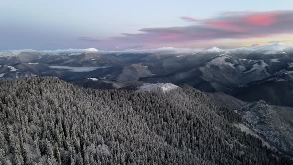 Drone Flying Above Mountain Valley at Golden Hour.