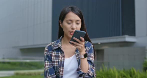 Woman work on mobile phone at outdoor