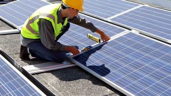 Male worker working at solar station 4k