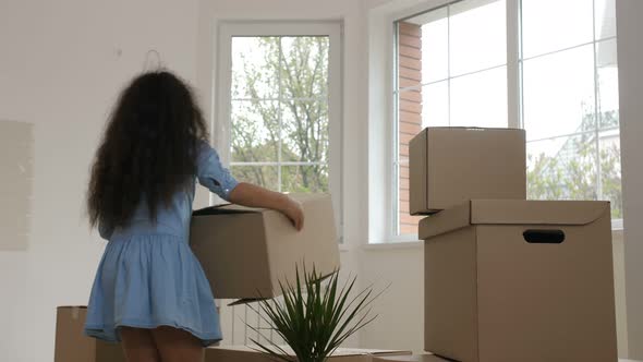 Cheerful Family Carrying Boxes in Purchased House