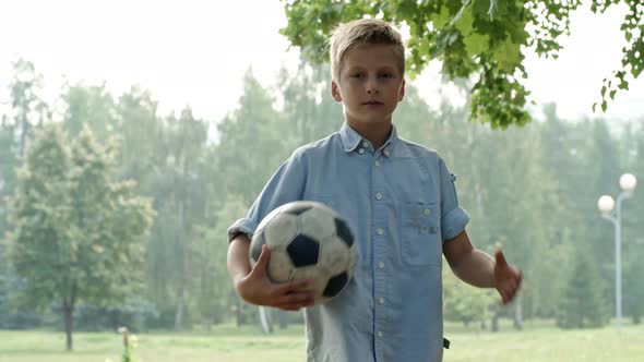 Boy Posing with Football