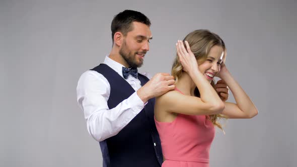 Happy Man Giving Diamond Necklace To Woman 8