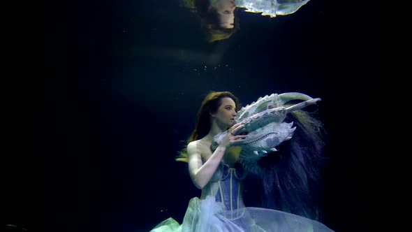 Beautiful Lady and Dragon are Floating Underwater Together Fantasy and Fairytale Slow Motion