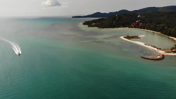 Blue Sea Near Beaches of Tropical Island. Breathtaking Drone View of Calm Blue Sea Near Tourist