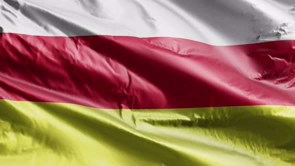 North Ossetia textile flag waving on the wind. Slow motion. 20 seconds loop.