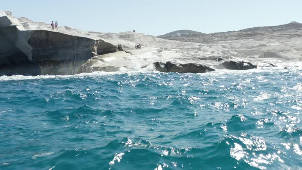 Aerial Drone Perspective of Iconic Lunar Volcanic White Chalk Beach and Caves of Sarakiniko, Milos