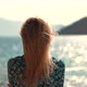 Woman Tourist Stands On Shore Enjoying Marine Views. Rocky Seacoast Beach. Girl Looking At Ocean. - VideoHive Item for Sale