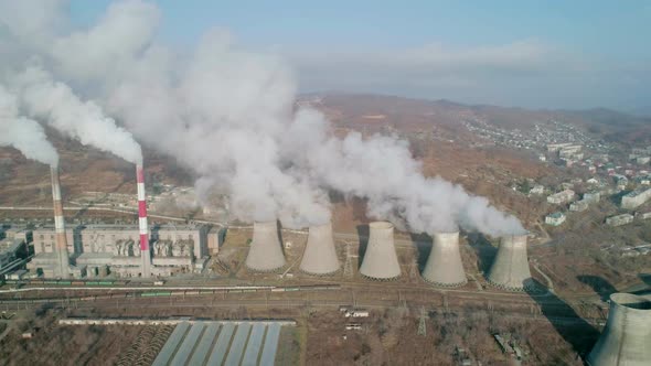 Aerial View of an Industrial Zone Pipes Pouring Thick White Smoke