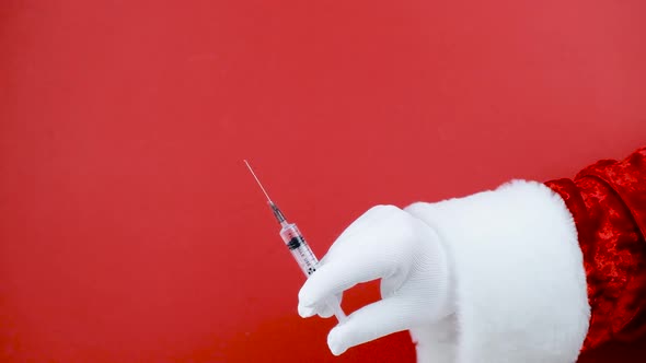 Santa Hand Syringe Medical Injection